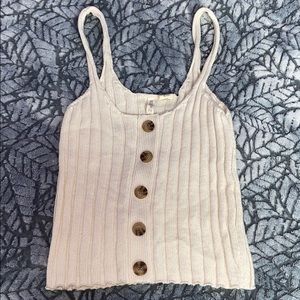 Beige tank with marble buttons down the middle